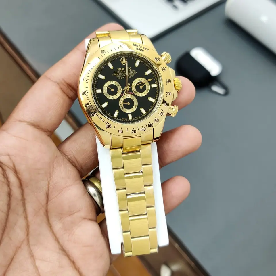 Rolex Daytona — black dial, gold