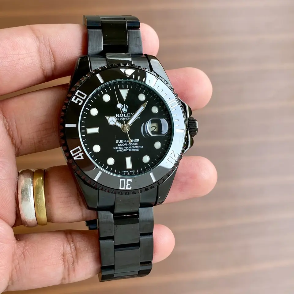 Rolex Submariner — black dial, black case