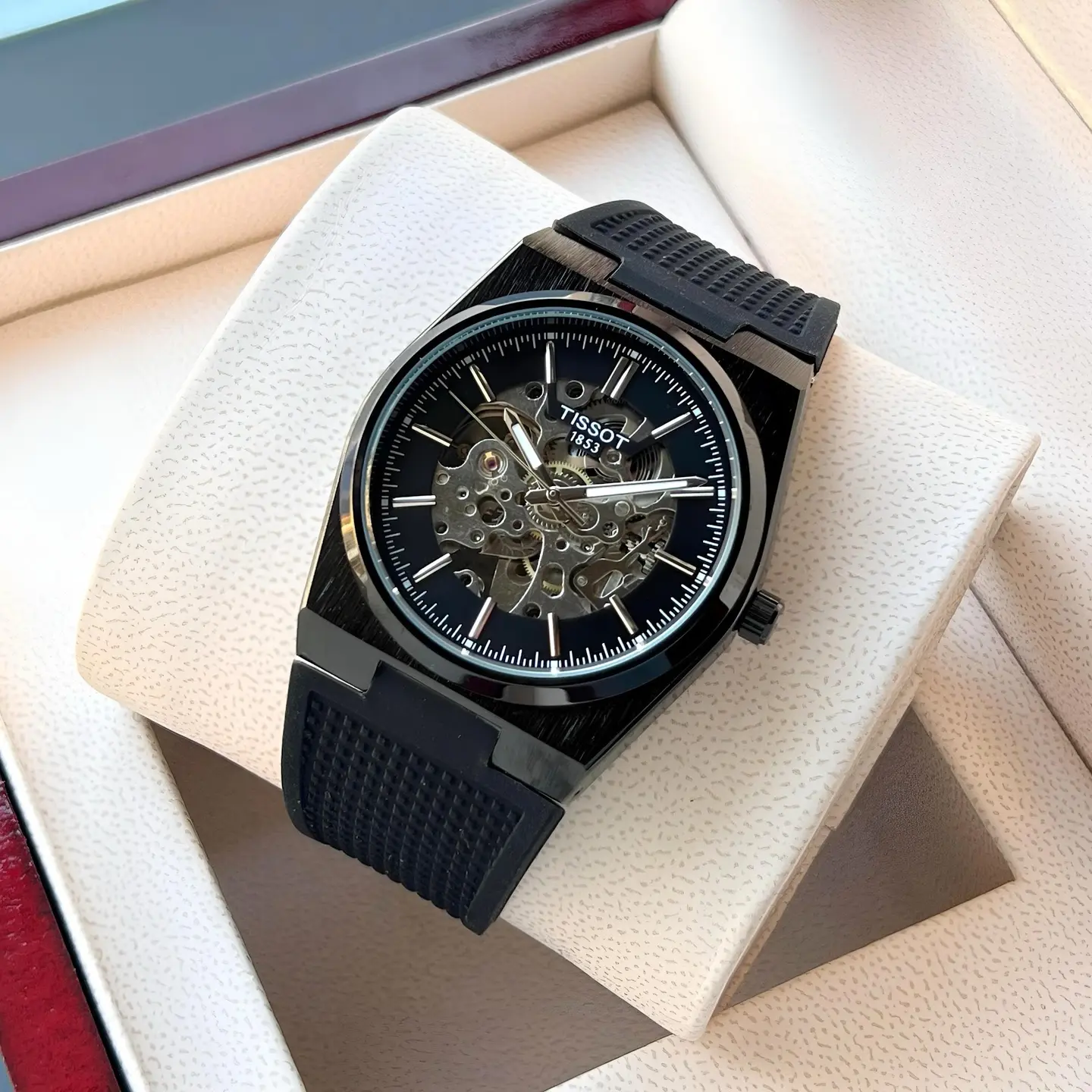 Tissot PRX — open-worked dial, black case