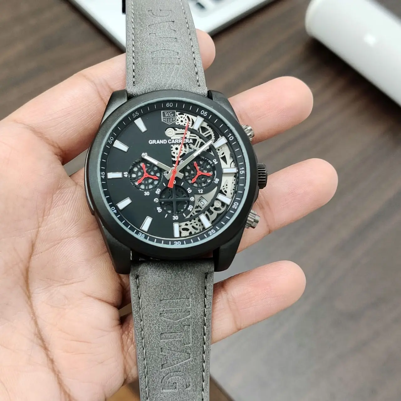 TAG Heuer Grand Carrera — open-worked dial, black case