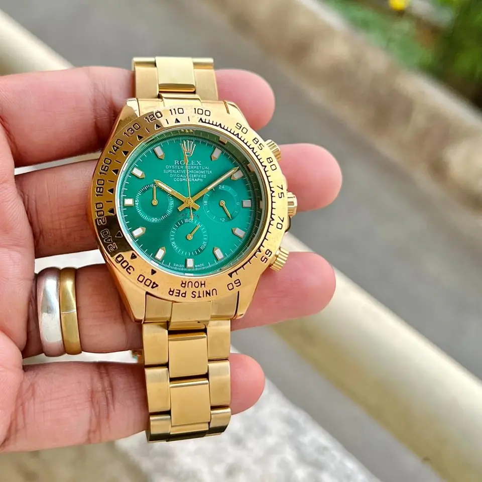 Rolex Daytona — black dial, gold