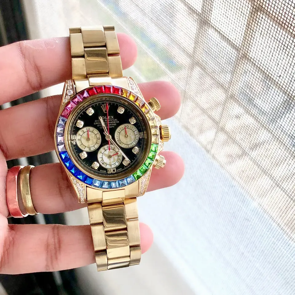 Rolex Daytona — black dial, gold