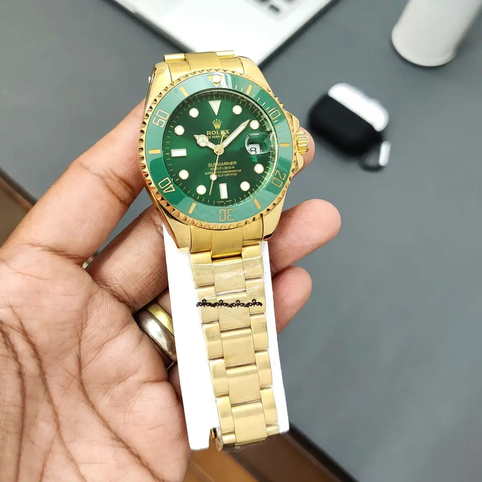 Rolex Submariner — green dial, gold