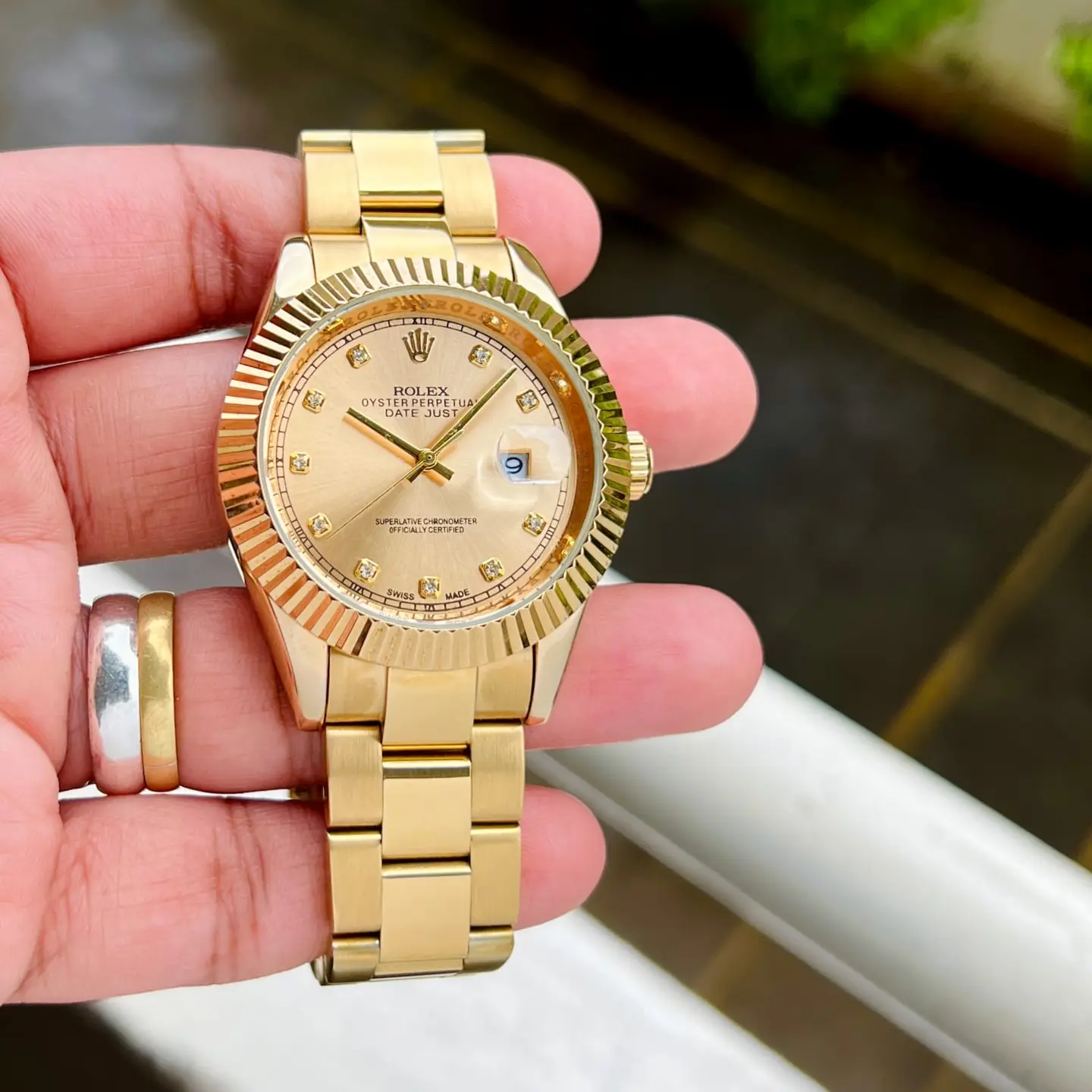 Rolex Datejust — gold dial, gold
