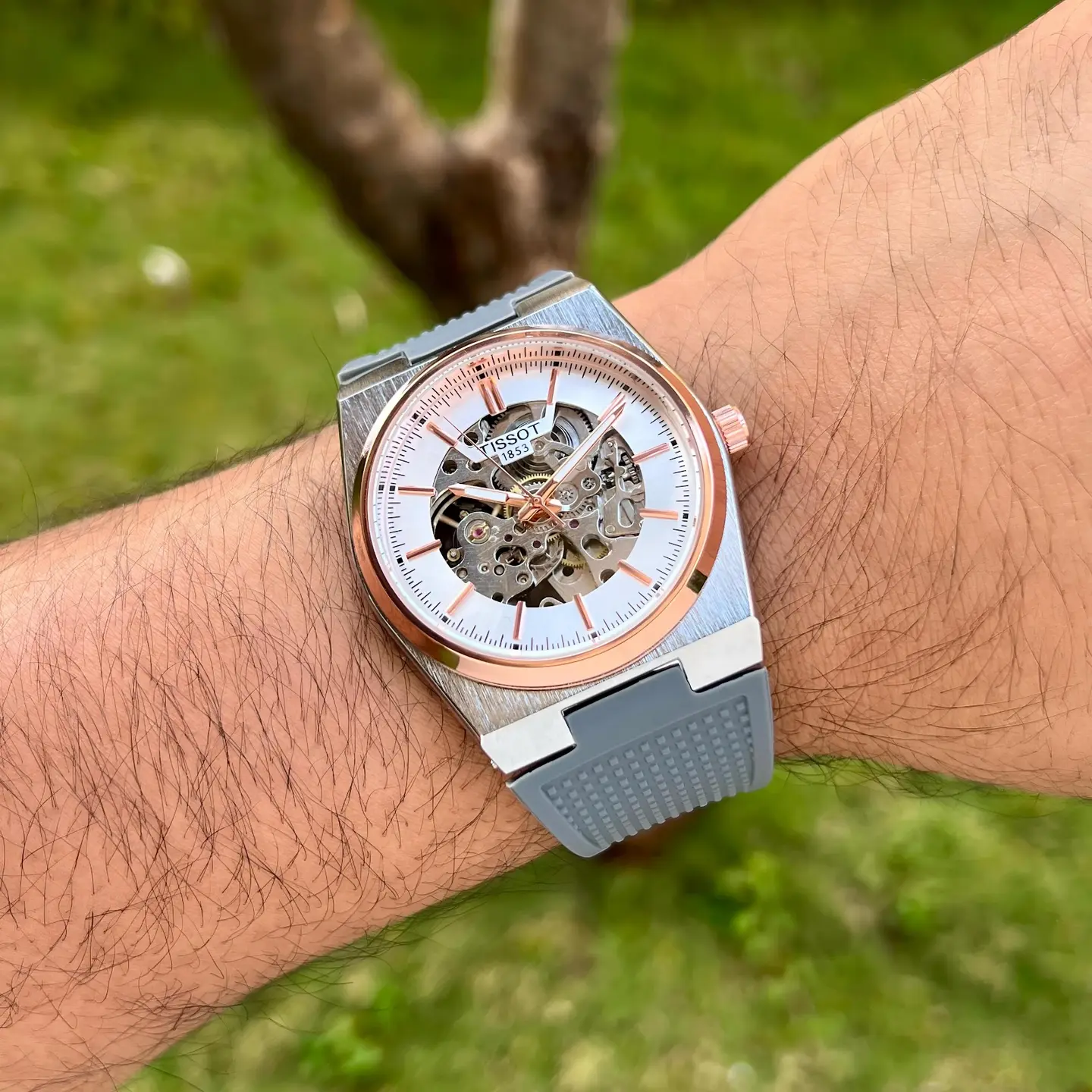 Tissot PRX — open-worked dial, two-tone