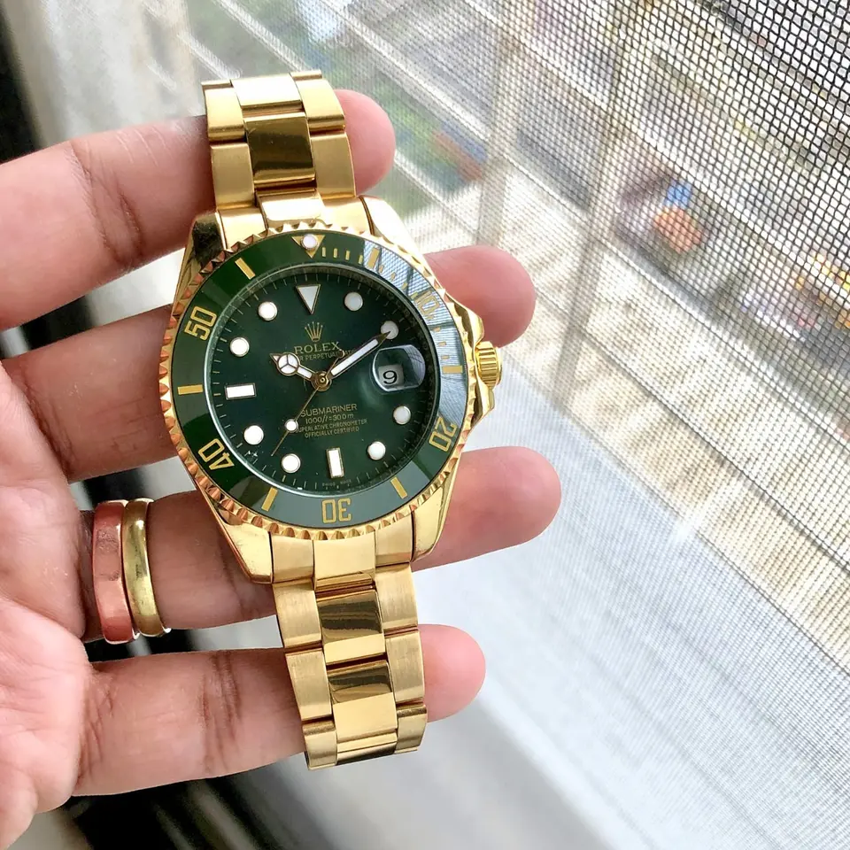Rolex Submariner — green dial, gold