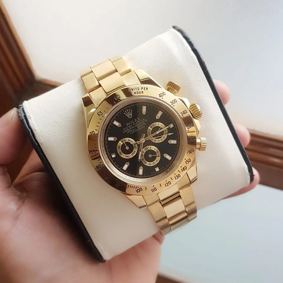 Rolex Daytona — black dial, gold